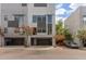 Modern townhouse showcasing a two-car garage, contemporary architecture, and mature landscaping at 4617 E Culver St, Phoenix, AZ 85008