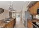 Open floor plan showcasing an updated kitchen with stainless steel appliances and an island sink at 4617 E Culver St, Phoenix, AZ 85008