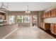 Bright kitchen area showcasing tile flooring, an island with seating, and views of the street at 4617 E Culver St, Phoenix, AZ 85008