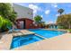 Community pool and spa with blue lounge chairs and manicured landscaping, perfect for relaxation at 4617 E Culver St, Phoenix, AZ 85008