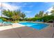 Community pool with lounge chairs and mature landscaping that provides a private, backyard feel at 4617 E Culver St, Phoenix, AZ 85008