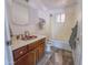 Bathroom features a single sink vanity, a shower-tub combo, and patterned floors at 4621 E Desert Forest Trl, Cave Creek, AZ 85331