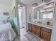 Bathroom with a single sink vanity, mirror, toilet, and shower, accessible from the bedroom at 4621 E Desert Forest Trl, Cave Creek, AZ 85331