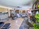 Spacious living room featuring a stone fireplace, wood-look floors, and comfortable seating at 4621 E Desert Forest Trl, Cave Creek, AZ 85331