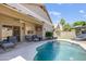 Backyard oasis with a refreshing pool, comfortable seating, and a covered patio, perfect for entertaining at 4762 E White Aster St, Phoenix, AZ 85044