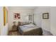 Cozy bedroom featuring a comfortable bed, soft carpet, and a window offering natural light at 4762 E White Aster St, Phoenix, AZ 85044