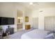Primary bedroom featuring attached bath, walk-in closet, and modern ceiling fan at 4762 E White Aster St, Phoenix, AZ 85044