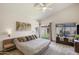 Light-filled bedroom with modern bed frame, sliding doors, and neutral walls at 4762 E White Aster St, Phoenix, AZ 85044