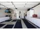 Spacious and organized garage with ample storage cabinets, workbenches, and well-lit workspace at 4762 E White Aster St, Phoenix, AZ 85044