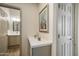 Hallway with a view of the bathroom and features a marble countertop and decorative items at 4762 E White Aster St, Phoenix, AZ 85044