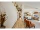 Bright hallway leads to the dining and living areas with decorative touches and neutral walls at 4762 E White Aster St, Phoenix, AZ 85044