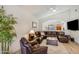 Inviting living room featuring comfortable leather seating and an open layout at 4762 E White Aster St, Phoenix, AZ 85044