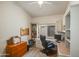 Functional home office with built-in shelving, desk space, and carpet flooring at 4762 E White Aster St, Phoenix, AZ 85044