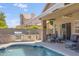 Backyard pool and patio area, includes a built in grill, covered patio, and plenty of space for entertaining at 4762 E White Aster St, Phoenix, AZ 85044
