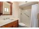 Functional bathroom with a vanity sink and a walk-in shower featuring safety grab bars at 5037 N 81St St, Scottsdale, AZ 85250