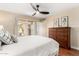 Light-filled bedroom with patio access, a dresser, and cozy decor for relaxation at 5037 N 81St St, Scottsdale, AZ 85250