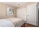 Comfortable bedroom featuring a closet and a window at 5037 N 81St St, Scottsdale, AZ 85250