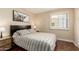 Comfortable bedroom with a modern design, featuring a large window with shutters and sleek furniture at 5037 N 81St St, Scottsdale, AZ 85250