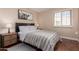 Serene bedroom with a large bed, two nightstands, and shuttered windows at 5037 N 81St St, Scottsdale, AZ 85250