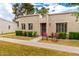 Inviting front of the home with well-kept lawn, trimmed bushes and two comfy chairs at 5037 N 81St St, Scottsdale, AZ 85250