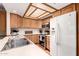 Well-lit kitchen with appliances and wood cabinets at 5037 N 81St St, Scottsdale, AZ 85250