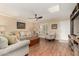 Cozy living area featuring wood floors, comfortable seating and a stylish ceiling fan at 5037 N 81St St, Scottsdale, AZ 85250