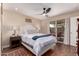 Comfortable main bedroom with a ceiling fan and access to the patio at 5037 N 81St St, Scottsdale, AZ 85250