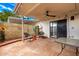 Cozy outdoor patio with ceiling fan, desert landscaping, and patio furniture at 5037 N 81St St, Scottsdale, AZ 85250