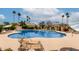 Enjoy the inviting community pool surrounded by lush landscaping and tall palm trees at 5037 N 81St St, Scottsdale, AZ 85250