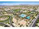 Aerial of community pools, landscaping, and surrounding residential area at 5518 S Dillon Cir, Mesa, AZ 85212