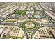 An aerial view of a neighborhood featuring a roundabout, community center, and pool at 5518 S Dillon Cir, Mesa, AZ 85212