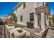 Outdoor patio with comfortable lounge seating, perfect for entertaining, set against a backdrop of green turf at 5518 S Dillon Cir, Mesa, AZ 85212