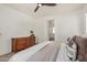 Bedroom includes ceiling fan, picture window, carpet, and an antique wooden dresser at 5518 S Dillon Cir, Mesa, AZ 85212