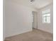 This bedroom features neutral carpet, white walls, baseboards, and an entry doorway at 5518 S Dillon Cir, Mesa, AZ 85212