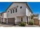 A two-story home boasts an attached two-car garage, tidy landscaping, and a neutral color scheme at 5518 S Dillon Cir, Mesa, AZ 85212