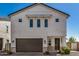 Charming home with two-car garage, a covered entryway, and well-maintained landscaping at 5518 S Dillon Cir, Mesa, AZ 85212