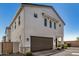 Exterior of a two-story stucco home with a two-car garage and neutral color palette at 5518 S Dillon Cir, Mesa, AZ 85212