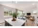Open concept kitchen with gray cabinets and center island, seamlessly connecting to the living area at 5518 S Dillon Cir, Mesa, AZ 85212