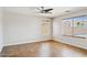 Bright bedroom with tile floors, neutral walls, and multiple windows that enhance the room's natural light at 5553 W Minton Ave, Laveen, AZ 85339