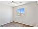 Cozy bedroom with brown carpet, ceiling fan and window offering natural light at 5553 W Minton Ave, Laveen, AZ 85339