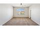 Well-lit bedroom featuring neutral paint, a ceiling fan, and a window at 5553 W Minton Ave, Laveen, AZ 85339