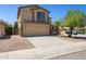 A two-story home featuring a two-car garage, neutral color palette, and low-maintenance landscaping at 5553 W Minton Ave, Laveen, AZ 85339