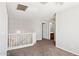 Upstairs loft area with carpeting, white railing, and neutral paint at 5553 W Minton Ave, Laveen, AZ 85339