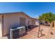 Paver backyard featuring siding, landscaping, an air conditioning unit, and a tree at 5735 E Mcdowell Rd # 464, Mesa, AZ 85215