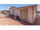 Paver backyard featuring siding, an air conditioning unit, and a screen door at 5735 E Mcdowell Rd # 464, Mesa, AZ 85215