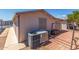 Paver backyard featuring landscaping, siding, and an air conditioning unit at 5735 E Mcdowell Rd # 464, Mesa, AZ 85215