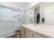 Functional bathroom with a vanity sink and enclosed walk-in shower, illuminated by natural light at 5735 E Mcdowell Rd # 464, Mesa, AZ 85215
