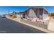Charming single-story home featuring a covered carport and beautifully landscaped front yard at 5735 E Mcdowell Rd # 464, Mesa, AZ 85215