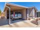 Charming single-story home featuring a covered carport and beautifully landscaped front yard at 5735 E Mcdowell Rd # 464, Mesa, AZ 85215