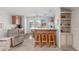 Inviting kitchen with wooden cabinets, marble countertops, and a breakfast bar with three wooden stools at 5735 E Mcdowell Rd # 464, Mesa, AZ 85215